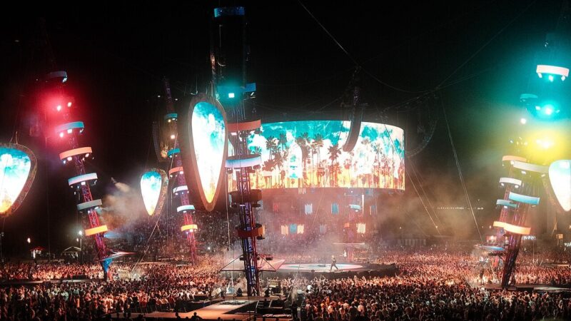 A concert stage lit in front of a crowd