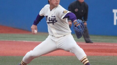 A pitcher on the mound in a stadium