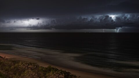 Lightning storm over the ocean at night