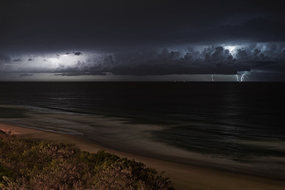 Lightning storm over the ocean at night